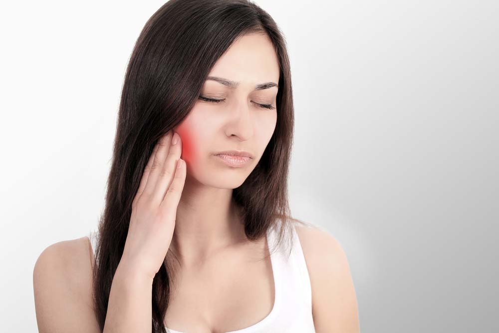 woman with TMD TMJ disorder jaw pain